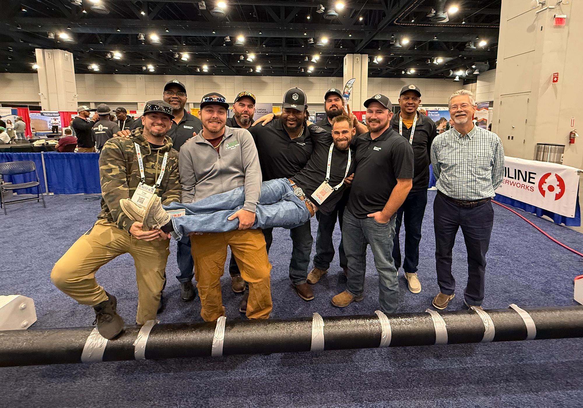 Group of men celebrate wins at competition.