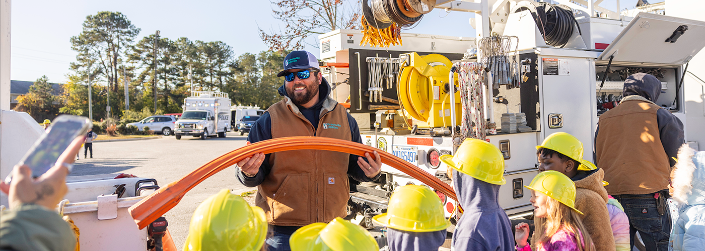 GUC employee at a touch-a-truck event